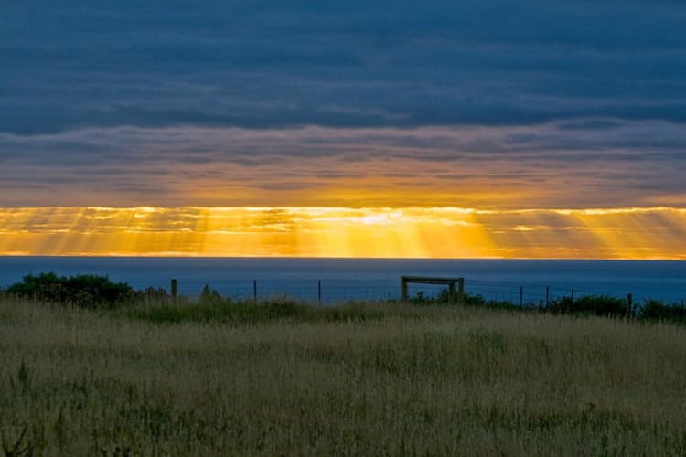 Morning sunrise rays from the Lodge late summer
